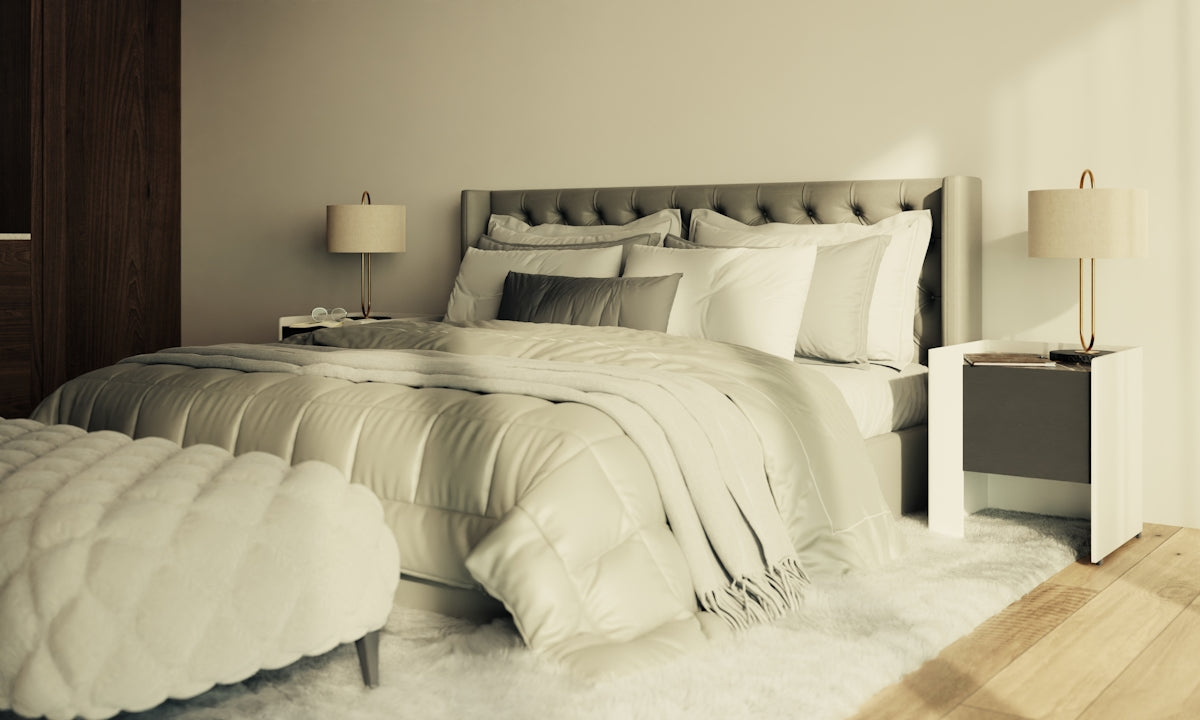 Luxurious bedroom with tufted headboard and plush bedding.
