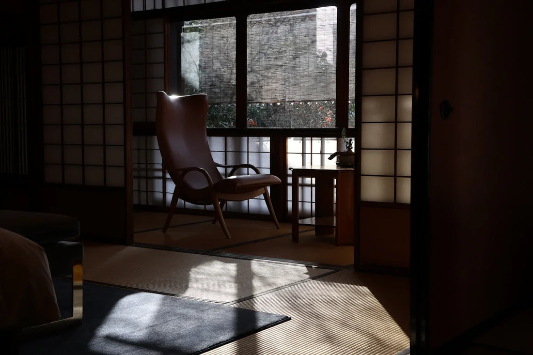 A room with a chair and a window in it