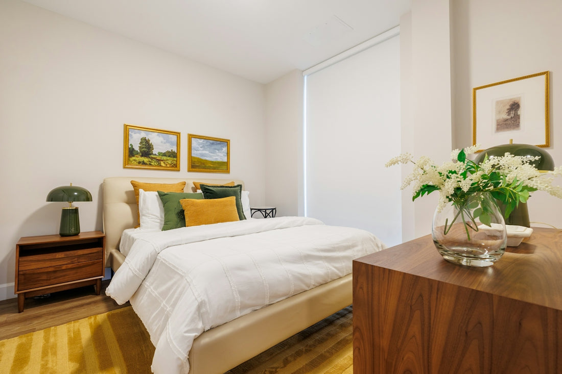 A modern bedroom with a bed and artwork