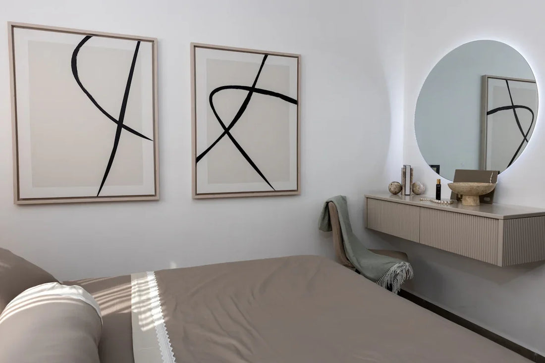Minimalist bedroom with abstract art and vanity.