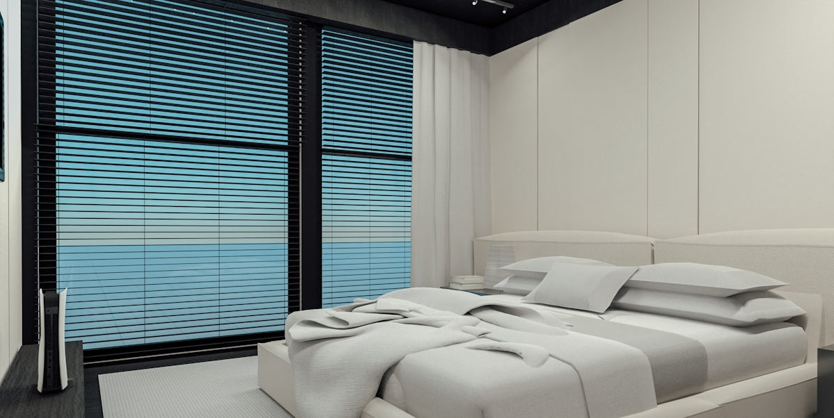 Modern bedroom with large windows overlooking the ocean