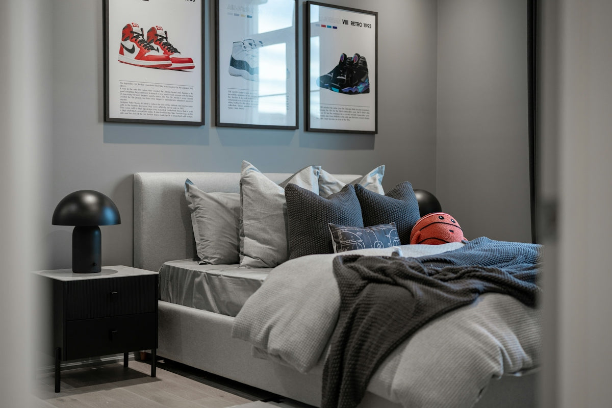 Bedroom with framed sneakers and a basketball