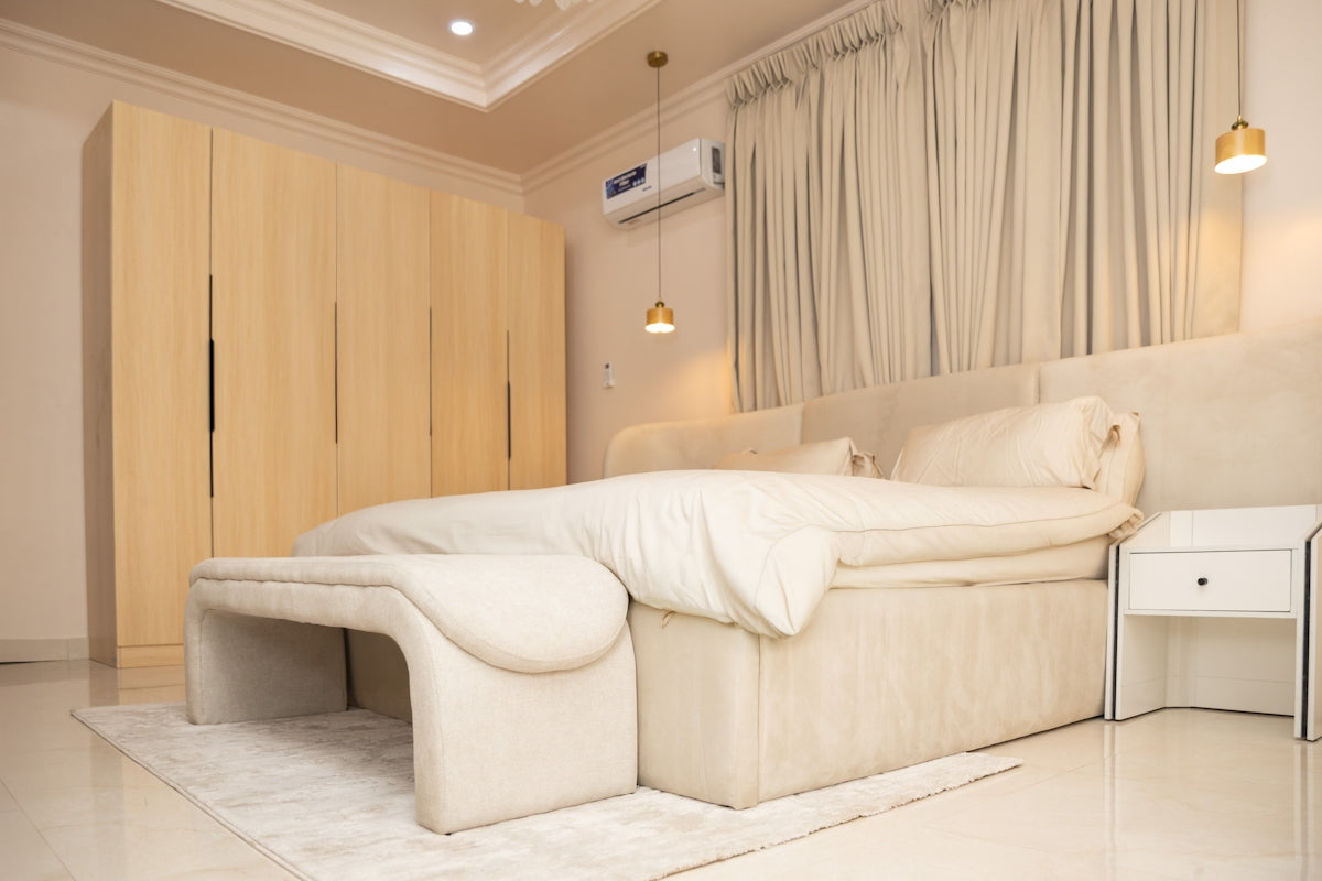 Elegant bedroom featuring a large bed and built-in wardrobes