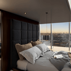 Modern bedroom featuring a upholstered TV bed with cube-stitched headboard and UK Beds Direct logo on the wall