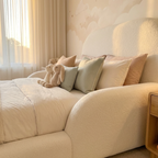 Curved padded edge of CloudNest bouclé kids bed for safety