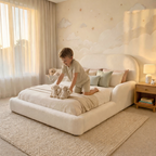 Child playing on soft bouclé CloudNest kids bed in modern bedroom