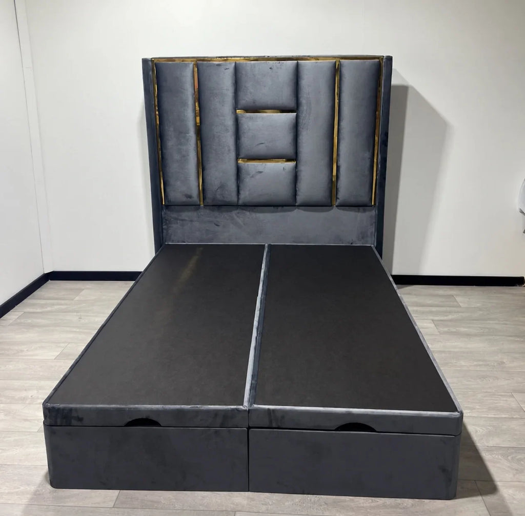 Front view of the Luxe Panel Ottoman Bed in grey upholstery with gold headboard detailing